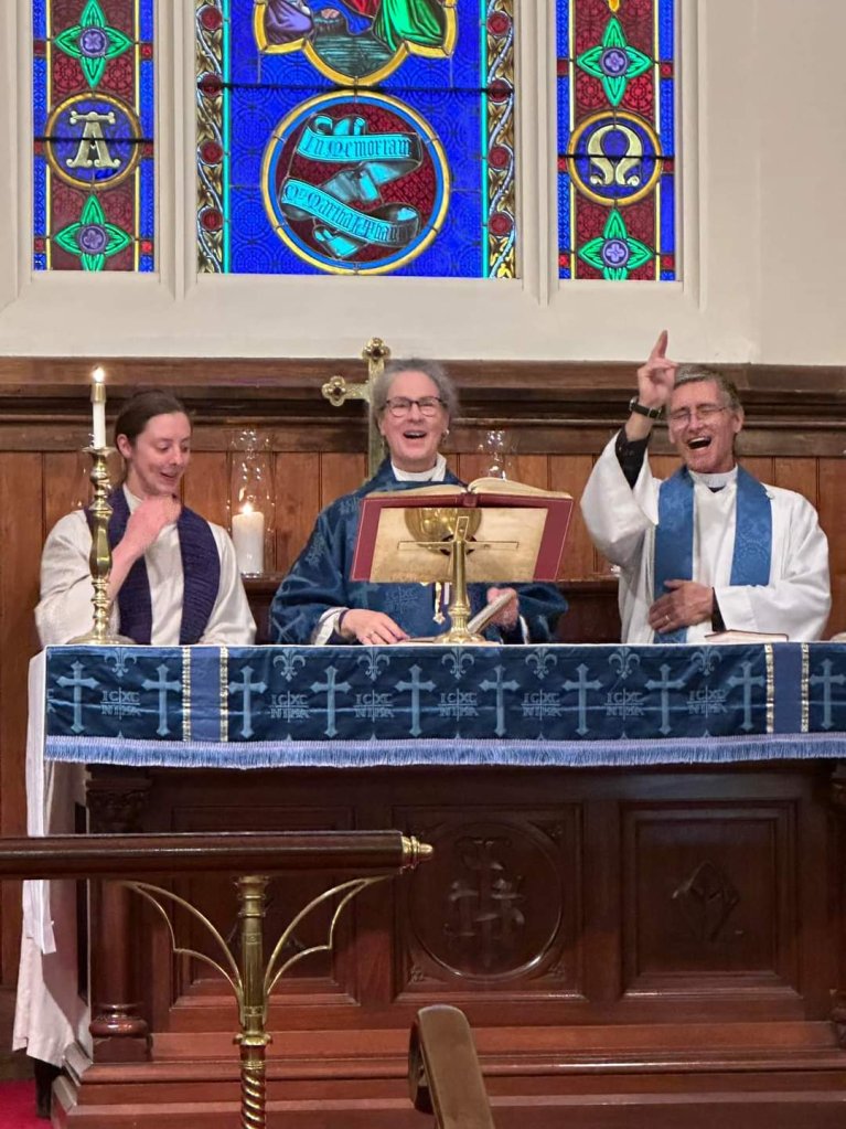 Advent I: Our clergy team of Earl, Rachel and Lee giving the blessing with great mirth!