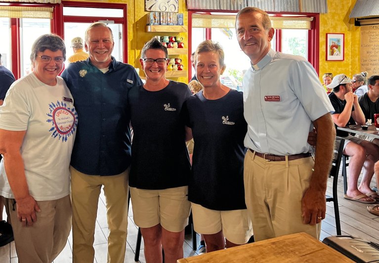 Rev. Bill and Sue Van Oss greet Mayor Johnson and Over Easy Cafe owners Trasi Sharp and Liza Clouse